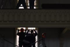 Crews install restored stained glass windows to their homes in the great hall at UPH in Saratoga Tuesday, June 4, 2019.