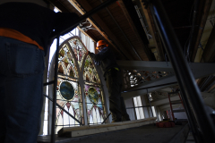 Crews install restored stained glass windows to their homes in the great hall at UPH in Saratoga Tuesday, June 4, 2019.